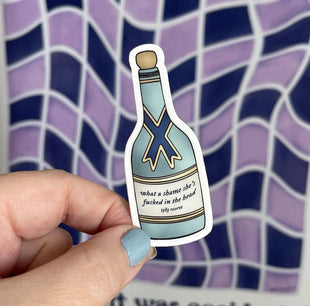 Champagne bottle What a shame she's fucked in the head sticker