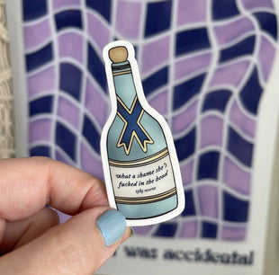 Champagne bottle What a shame she's fucked in the head sticker